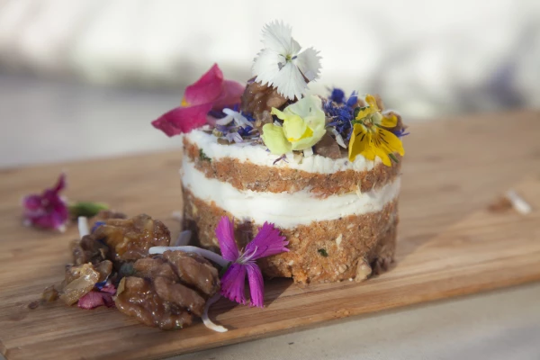 This photo captures how raw vegan food can not only look good but also taste delicious. Raw vegan carrot cake without any refined sugar, gluten, diary and all chemical free with medicinal properties. For Certifified organic stores in Sydney "Orchard St" elixir bars.