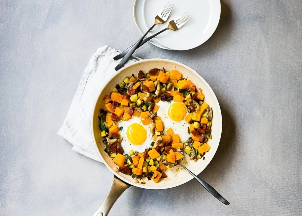 One of my family’s weekend brunch favorites is this savory hash. Butternut squash, zucchini, chorizo, onions and mushroom variety together make this dish rich in flavors and comforting.  Of course with fresh eggs cracked into the hash just minutes before its done adds a wow factor. We like to dip toasted bread slices into the yolks while scoop up some of the hash at the same time. This is what weekend living is all about.