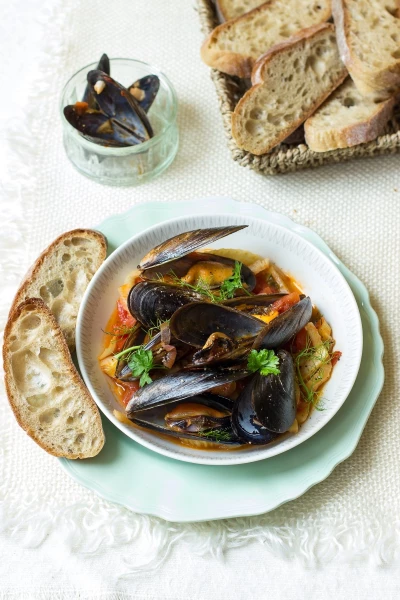 This a photo of mussels stewed with tomatoes, wine and fennel. The picture was created for the Polish "Dbam o zdrowie" Magazine as a part of a seafood photoshoot. 