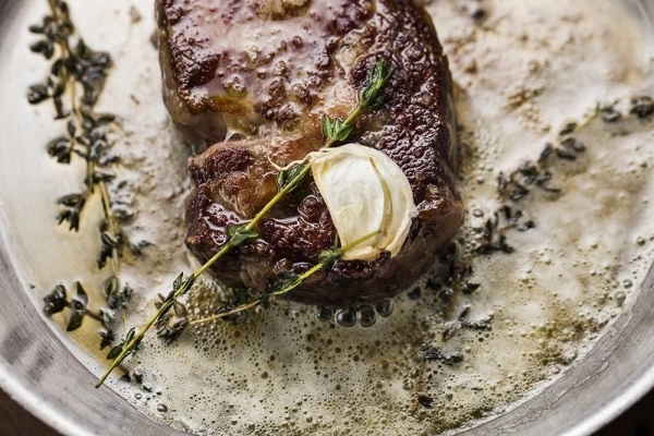 Featured in The Telegraph Food & Drink Magazine, M Restaurant’s Mike Reid speaks of the simple ways of cooking Rib Eye Steak (http://www.telegraph.co.uk/food-and-drink/recipes/pan-fried-rib-eye-steaks/). This image was shot as part of their recipe book M 24Hours (https://mwinestore.co.uk/shop/m-the-24-hour-cookbook-by-executive-chef-michael-reid/) with the butter still sizzling and the beautiful texture of the steak glistening, it’s one of my favourite images from the book. More images can be seen at www.jodihinds.com or @jodihindsphoto