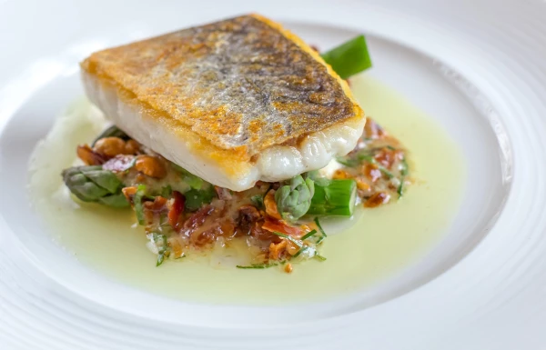 The picture was taken in Cornwall, Uk in Nathan Outlaw restaurant Cooked by the very talented Chef Tom Brown using only the very best of Cornish Seafood. Hake ~ Bacon & Hazelnut  Dressing ~ Asparagus. Delicious!! Picture again was only taken in available natural light.