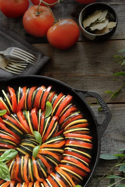 The thinly sliced yellow and green zucchini, Japanese eggplant, and tomato laid on top of a tomato puree, make this dish not only delicious, but so beautiful to look at.