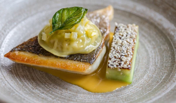 Fillet of Sea Bream with toasted cucumber and crab ravioli by Chef Tom Kerridge and team at The Coach in Marlow Uk.