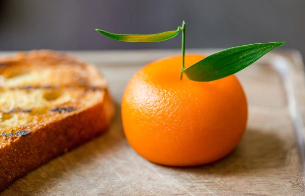 Meat Fruit by the Heston Blumenthal team at Dinner in London. Chicken liver parfait disguised as a Mandarin. 