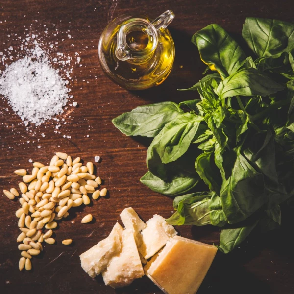 Making the famous italian "pesto". Just few and easy ingredients: basil, oil, pine nuts, Parmigiano Reggiano and salt. The word "pesto" comes from the italian verb "pestare", to pound in a traditional marble mortar.