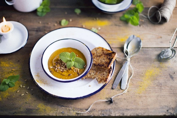 Sweet potato and pumkin soup, decorated with sunflower seeds and fresh mint - the idea behind the picture was to present food in a natural way.