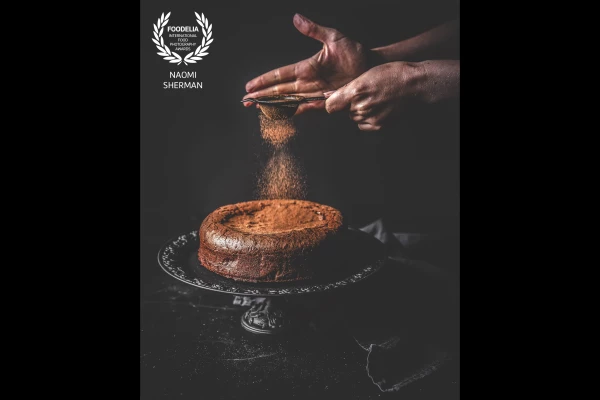 This rich and fudgy chocolate cake was baked from the favourite recipe of a friend for her birthday.<br />
The warm chocolate tones are beautifully set off against the dark background and the sidelight catches the finer details of the cake perfectly