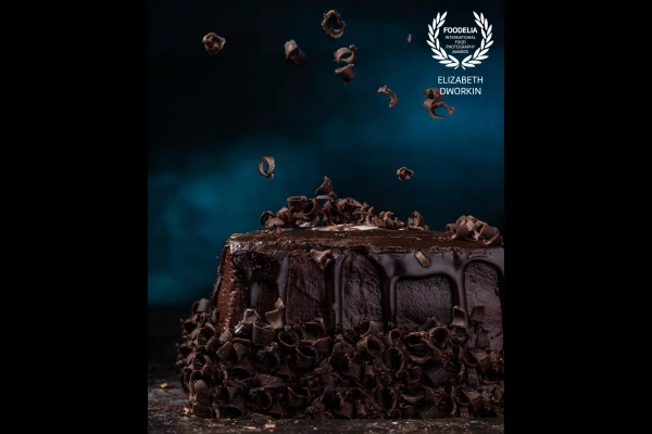 This chocolate cake sat in my house for days until I could find time to shoot it. None of the chocolate chips wanted to fall at the right time, but it was a fun sticky mess. Also, this was the first time I introduced gels (the blue light) into my photography!